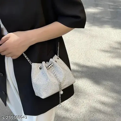 White pearl beaded sling bag, long shoulder strap, small chain link accent