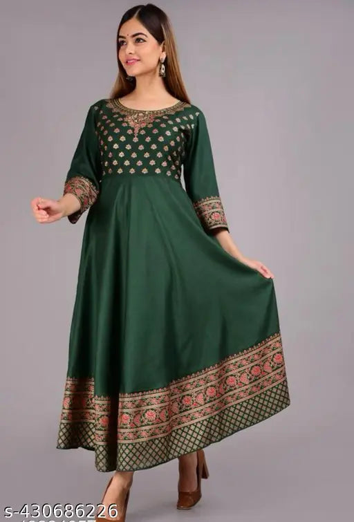 A woman in a green printed kurta with long sleeves and embroidery