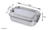 A heavy weight stainless steel lunch box, rectangular shaped, with a secure lid and plastic handle