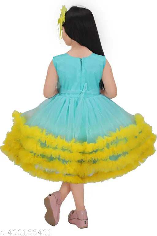 A child's frock dress in shades of green, yellow, and blue, designed with a feathered skirt for kids girls' casual party wear