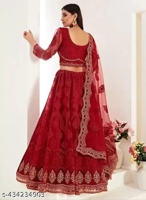 Red net lehenga choli with traditional chain work embroidery, perfect for Indian weddings or festivals