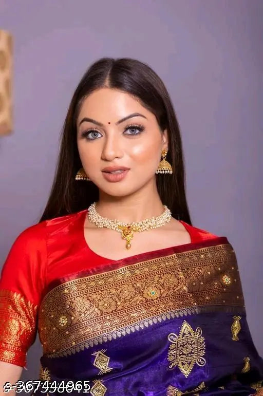A woman in a vibrant red saree, showcasing traditional Indian attire