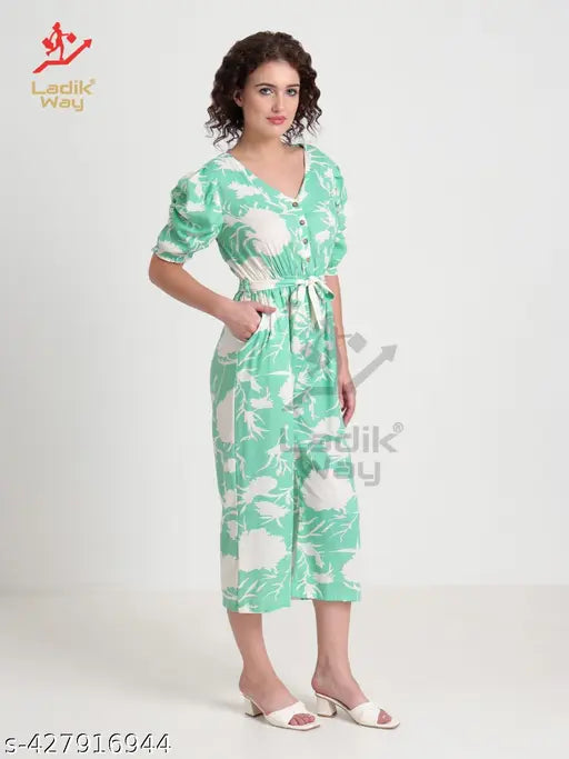 Trendy Pista printed cotton blend long jumpsuit with puff sleeves, v-neck, button closure. Modern women's style, multicolor pattern, India origin