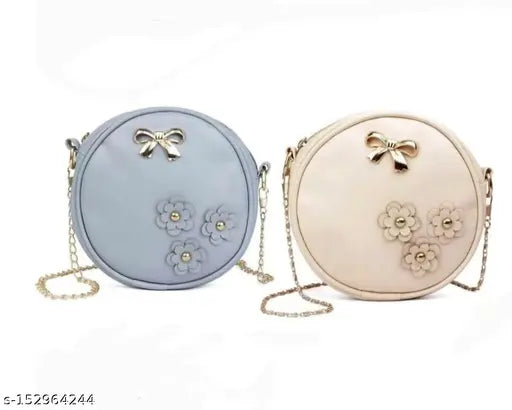 Grey and cream sling bag, both with bow accents and multiple card slots