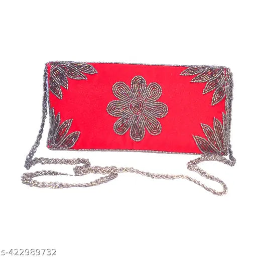Trendy red clutch with chain accent