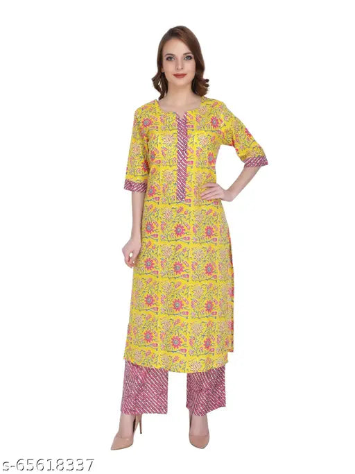 Yellow printed kurta palazzo set with three-quarter sleeves, organic cotton, handcrafted by UBUNTU FASHION for summer garden parties. Embroidered butterfly front, zip closure on back