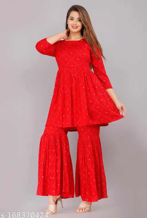 Red long sleeved kurta with flared pants, long flared hemline