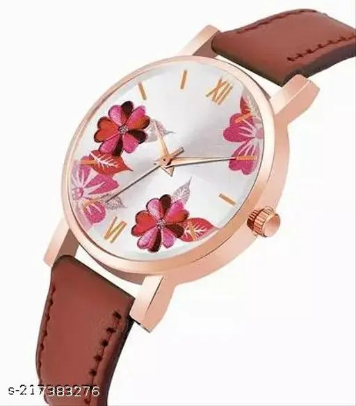 Women's stylish analog wristwatch with pink floral case, gold hands, and brown leather band