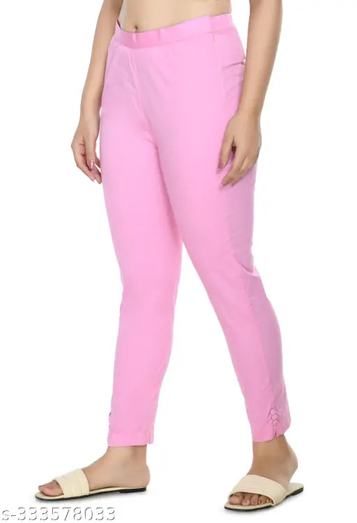 Baby pink solid cropped cigarette trousers by Preego, women's slim fit cotton blend trousers with half elasticated waistband, available in sizes 26-44 (IN)