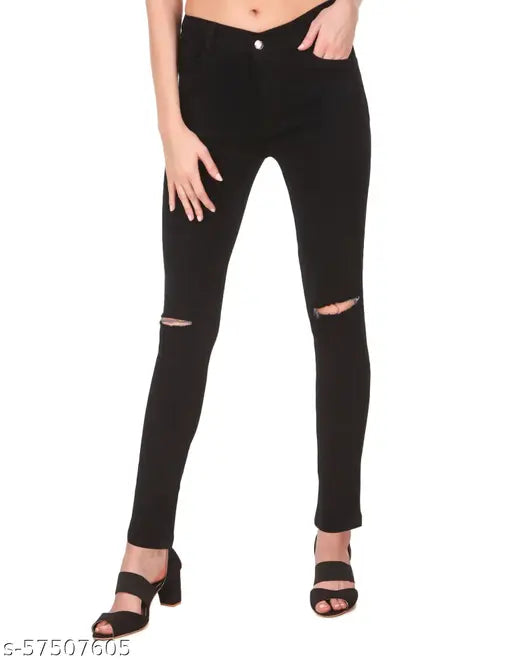 Black skinny jeans with distressed patches, high waist