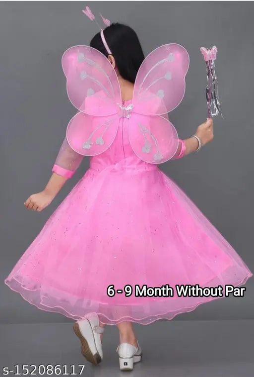 Pink cotton ethnic gown with three-quarter sleeves, solid pattern. Traditional Indian dress for girls' special occasions like birthdays and weddings. Made by UD Fashion (AJ Enterprise). Perfect for little princesses and girls' fashion