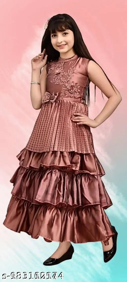 Pink silk blend embroidered full length party dress for girls, high quality ethnic wear with long sleeves. Ideal for parties, birthdays, or outings. Made of fine blackberry silk and available in sizes 3-4 years to 11-12 years. Origin: India