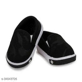 The image shows a pair of black casual slip-on boots, possibly featuring a patterned trim