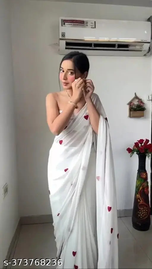 Red saree with white border and red heart pattern