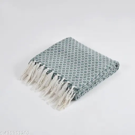 Mint green and white cotton diamond woven throw, versatile for indoors or outdoors, ideal for beds, sofas, or baby blankets. Luxurious, lightweight, and easy to maintain with breathable fabric. Reversible design offers a stylish touch to your home decor