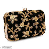 Black embroidered clutch with intricate sky wing design, sleek and compact for evening wear