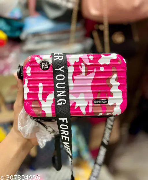 A pink camouflage box bag with a visible black strap and brand name