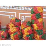 Multicolored traditional Indian turbans, crafted from colorful fabric, likely for wedding or festival celebration