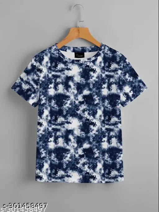 The image displays a tie-dye T-shirt with a blend of blue and white colors. The material appears to be cotton, giving it a soft and comfortable feel. This T-shirt is part of a women's or girls' collection, and it can be used for regular fit styles as well as oversized looks. It's an exclusive design from Kalindri, which makes it perfect for those who like unique and vibrant clothing