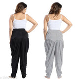 Black and white checkered patterned dhoti pants with a tie waist, long sleeves and straight legs