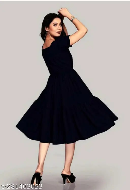Women's black knee-length dress with flared skirt