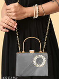 Black clutch with diamond frame and strap, featuring a white chain