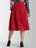 A woman wearing a red flared skirt with fluttering detailing and black heels