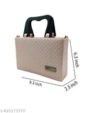 Ladies small beige quilted shoulder bag, black trim, top handle and long strap