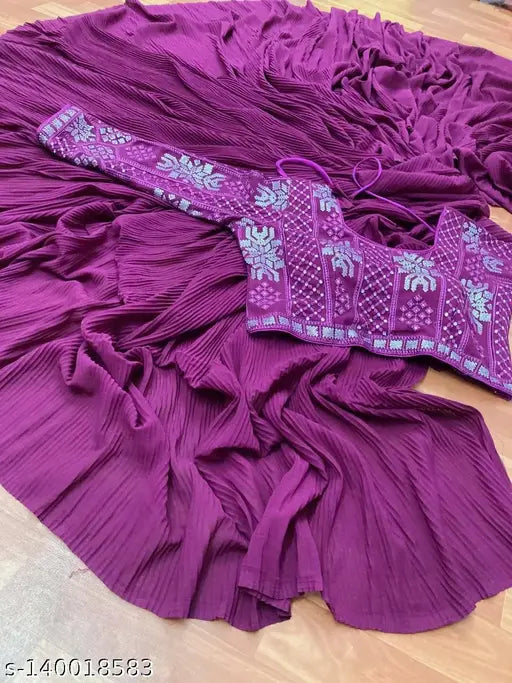 Vibrant purple ruffle sari with fringe detail, embellished with silver paisley design