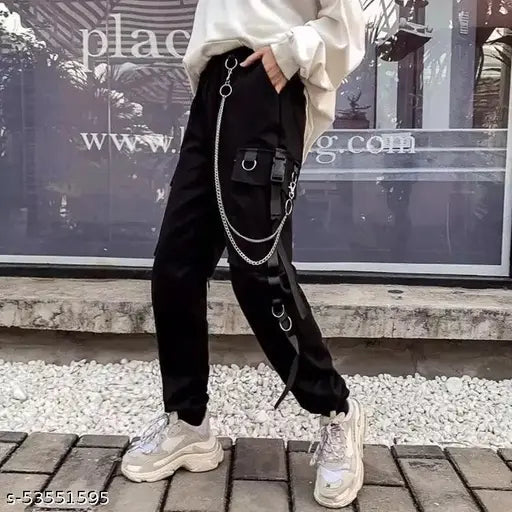 Hip-hop style black stretchable fabric jogger pants with silver chains, large pockets and a side drawstring