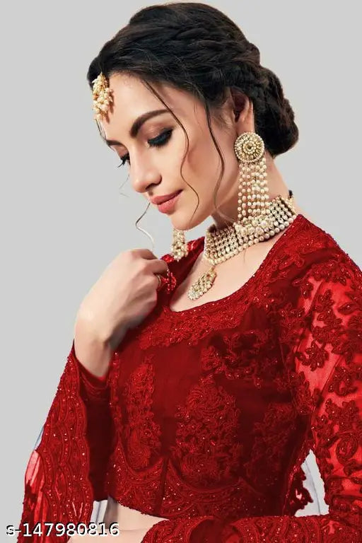 Red embroidered semi-stitched net lehenga choli and dupatta set, intricately embellished Indian bridal attire