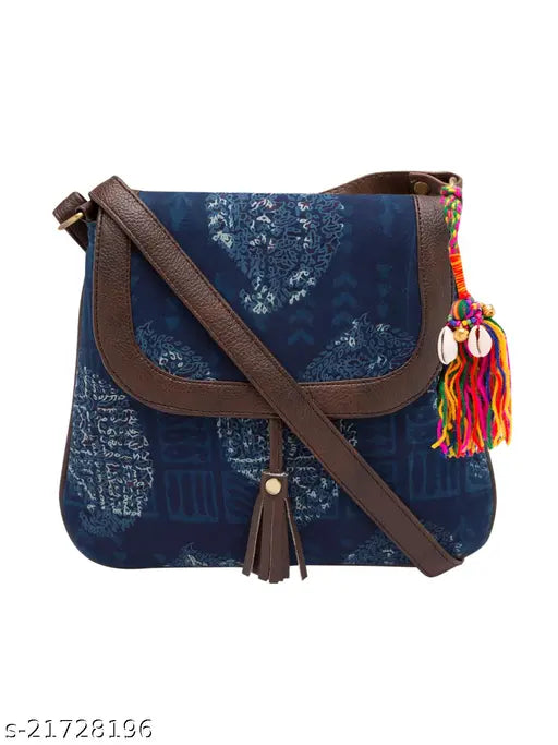Indigo tassel detail sling bag with brown strap and fringe