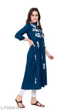 Woman in blue embroidered kurta standing