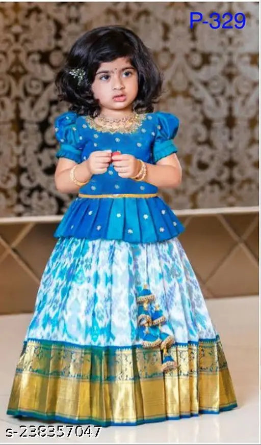 Modern classy kids' cotton lehenga cholis with embellished ethnic motif, short sleeves and stitched net. Size range: 12-18 months - 14-15 years. Indian-made