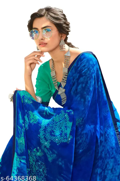 Georgette saree in teal blue, embellished with intricate designs