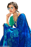 Georgette saree in teal blue, embellished with intricate designs