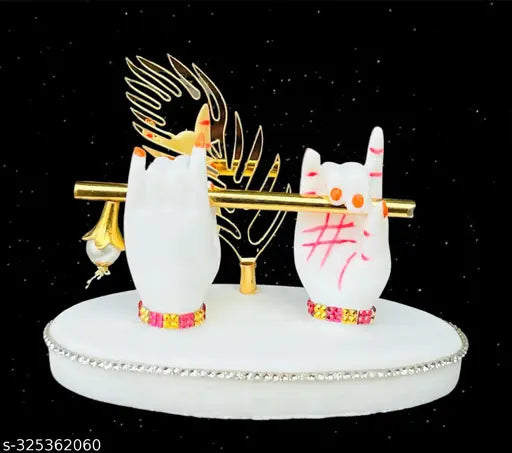 Black, white, and gold figurine of Krishna statue with peacock feather