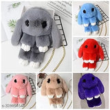 Multi-colored soft sling bag with plush rabbit design, featuring a chain for travel, perfect accessory for girls