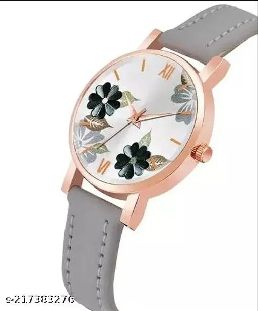 Women's analog wristwatch with floral design and white face