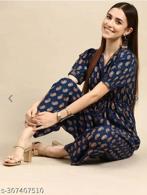 Navy blue rayon printed jumpsuit with short sleeves, features sizes from XXS to XXL. Model wears size M on mannequin
