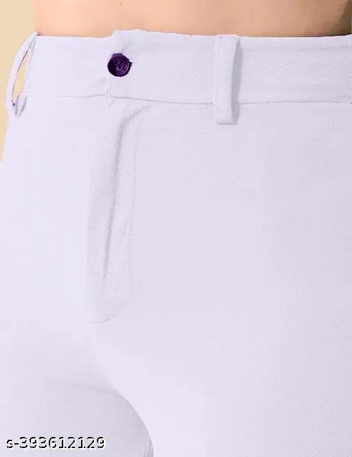 The image displays a pair of women's slim fit trousers in black. They appear to be made from a material with a subtle sheen, possibly cotton or polyester. The trousers feature two side pockets and a waistband that suggests they may have an elasticated design for easier fitting. There is no visible closure mechanism, suggesting the trousers might have zippers or buttons not in view