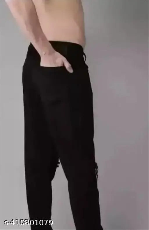 Black denim jeans for men with distressed knees, solid pattern from Shriradhe Enterprises