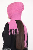 Pink knitted beanie with fringe, black long-sleeved shirt