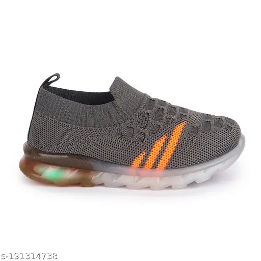 Black, orange and white sneakers with glowing LED light soles