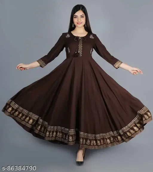 Brown Anarkali dress with embellished borders and detailing, possibly featuring traditional Indian designs