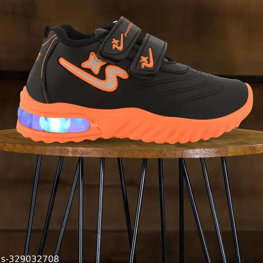 Orange and black casual sport shoes with LED lights, lightweight design, velcro closure for little kids