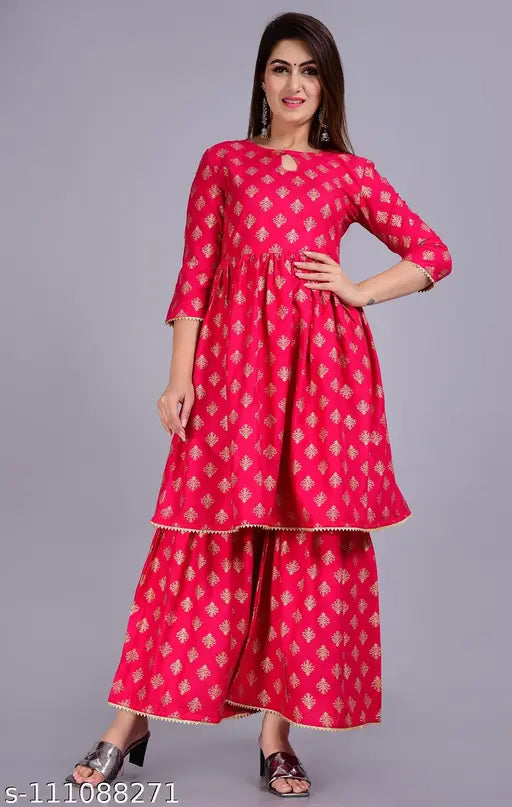 Red and white embroidered kurta with sharara pants, fitted waist, and long sleeves