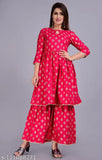 Red and white embroidered kurta with sharara pants, fitted waist, and long sleeves