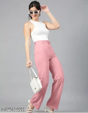 A person in a casual outfit, showcasing pink high-waisted trousers
