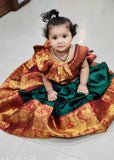 New Traditional kids unstitched half saree, litchi silk in free size. Unstitched blouse and dupatta with woven design, tassels included. Beautifully accessorized with a belt. Indian-origin traditional wear for little girls